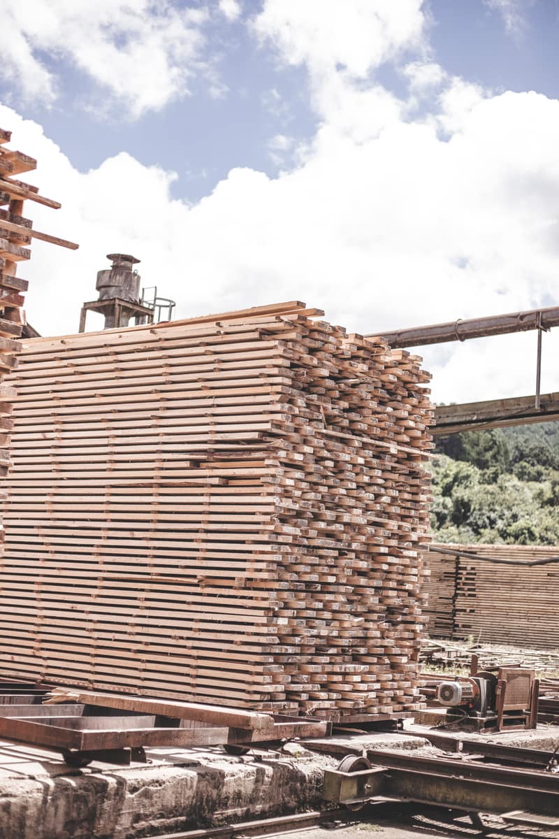 Stacked SAFCOL lumber planks